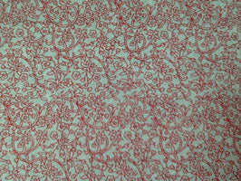 Lino rústico con ramas sobre rojo.