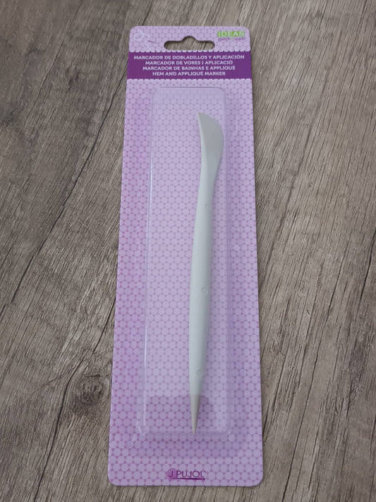 Marcador de dobladillos y aplicación.