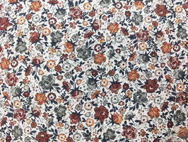 Villela floral con tonos cálidos de otoño. Tela de confección para los más peques , camisas , vestidos